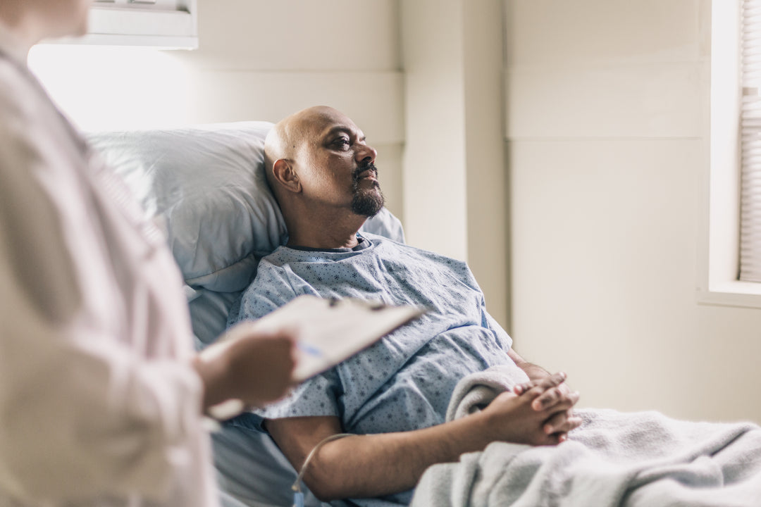 Patient in hospital bed being treated - 20% of the NHS budget is spent on disease-related malnutrition